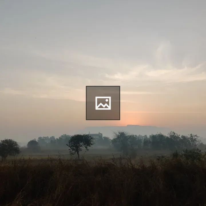 Sunrise over Mountain with Building