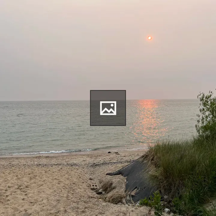 Sunset over Lake Michigan beach