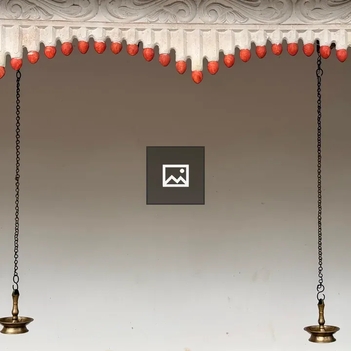 Two hanging brass oil lamps