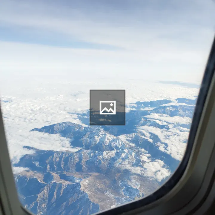 Mountains and clouds from airplane window
