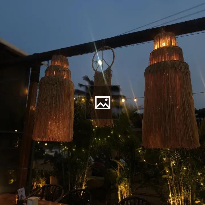 Outdoor dining lamps at dusk