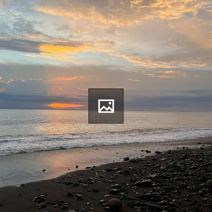 Beach at sunset with orange clouds