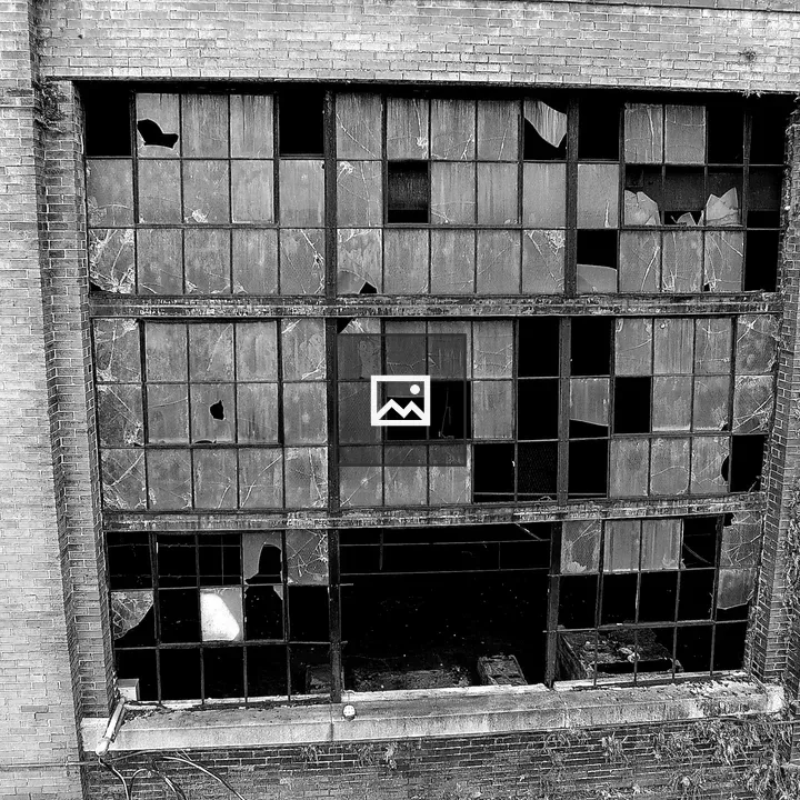 Broken windows at disused power station