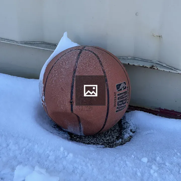 Basketball by Snowy Wall