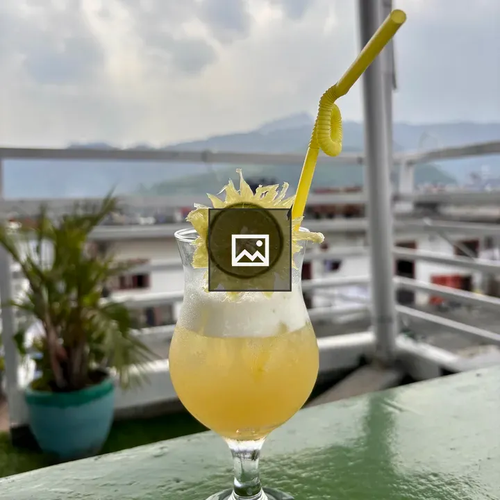 Tropical drink with lime garnish