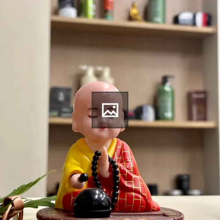 Monk Figurine with Gong