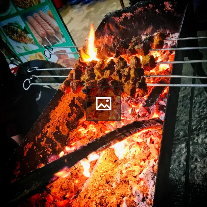 Grilling Sekuwa over Open Flame