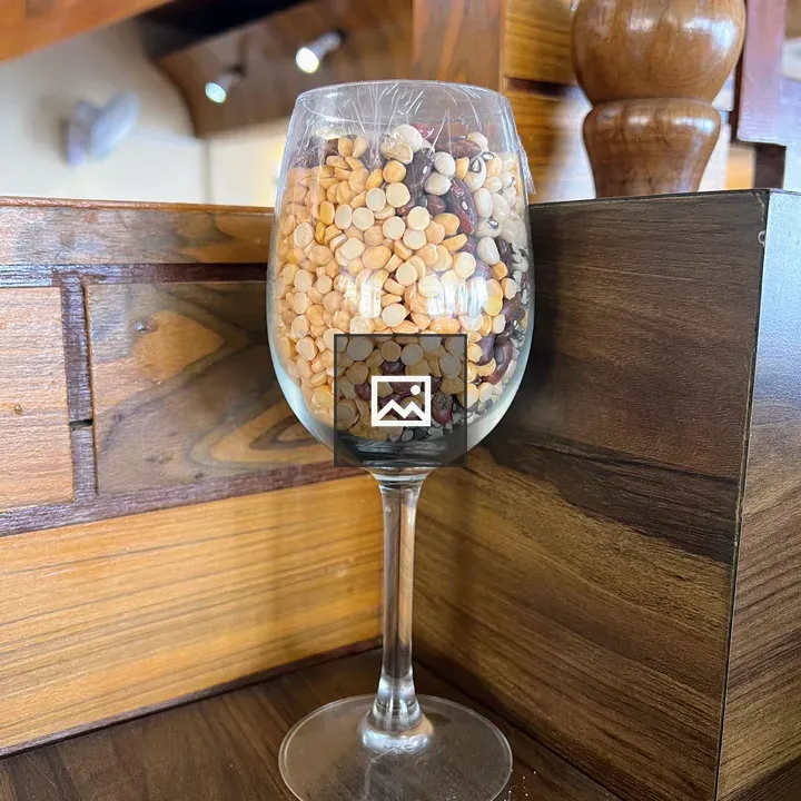 Wine glass with colorful dried beans
