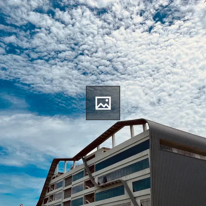 A cloudy sky over modern building