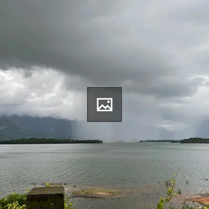 Rain over a lake and mountains