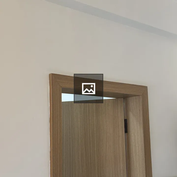 Wooden door frame against white wall
