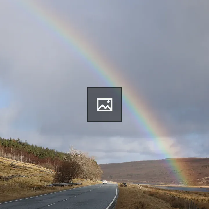 Rainbow over the road in Highlands