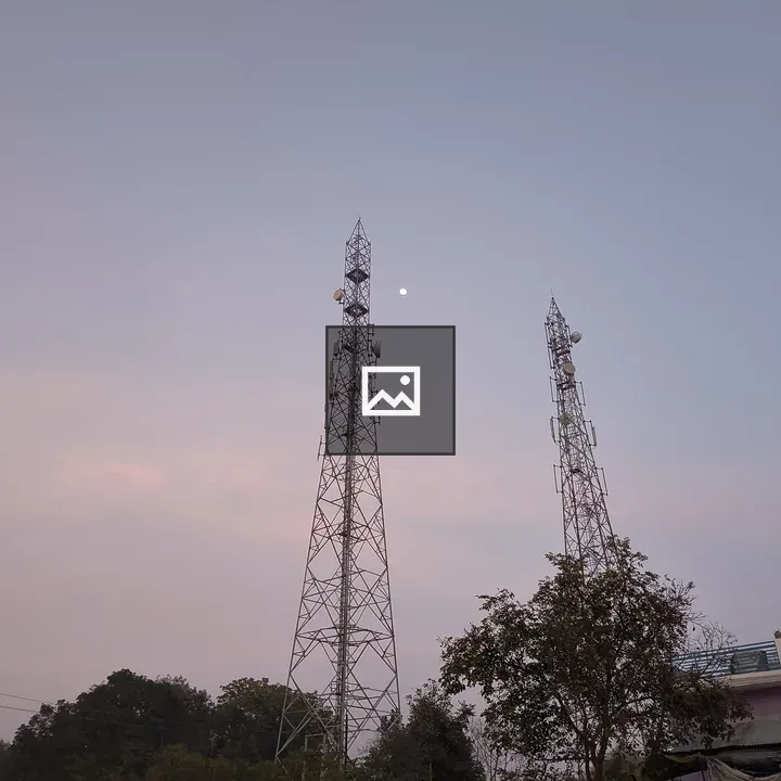 Two internet network towers in field