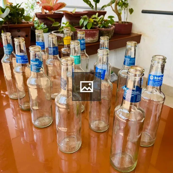 Empty flavoured soda glass bottles