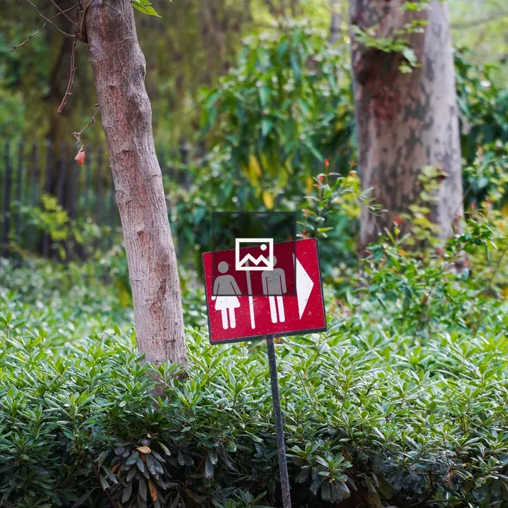 Suspicious Bathroom Sign in Park