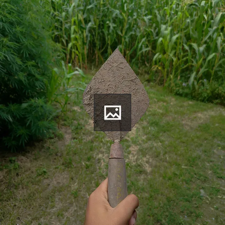 Hand Holding Garden Trowel