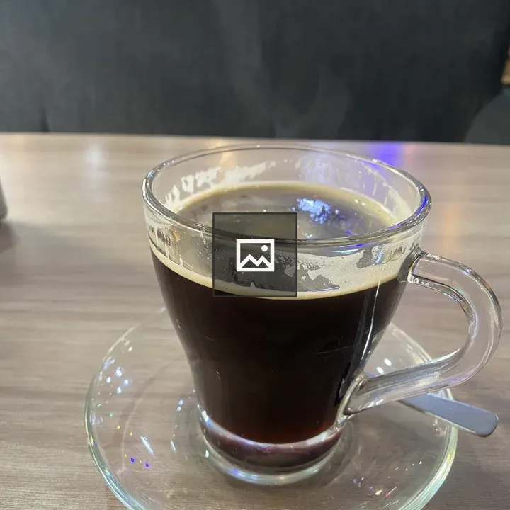 Coffee in Glass Cup on Wood