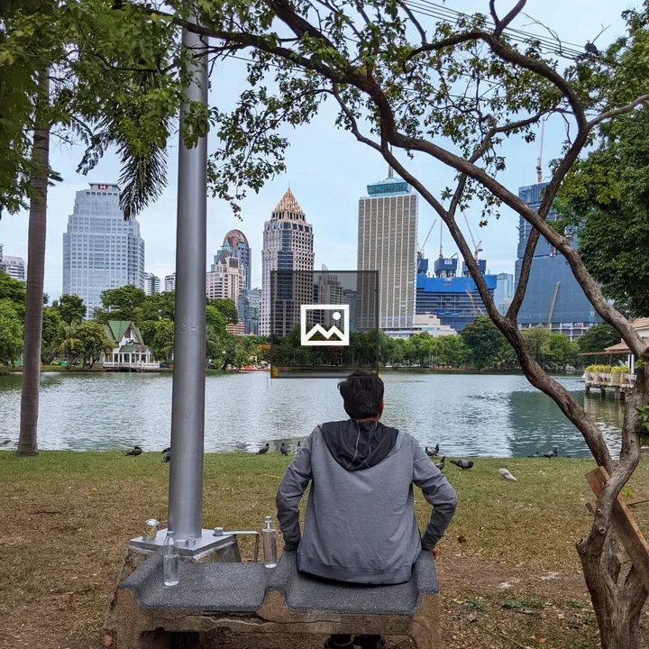Person on bench in Lumphini Park