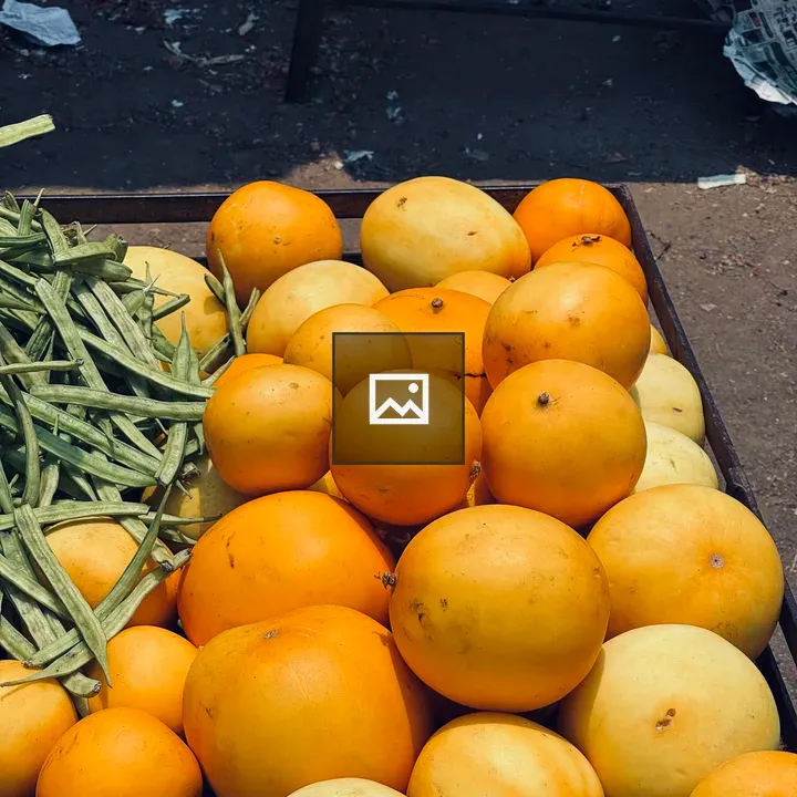 Heap of yellow melons on wood