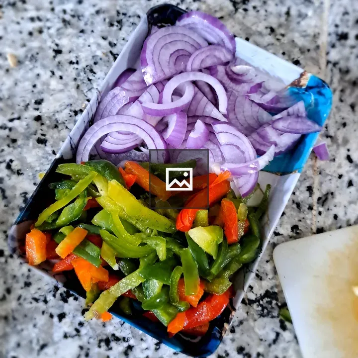 Onions and bell peppers on countertop