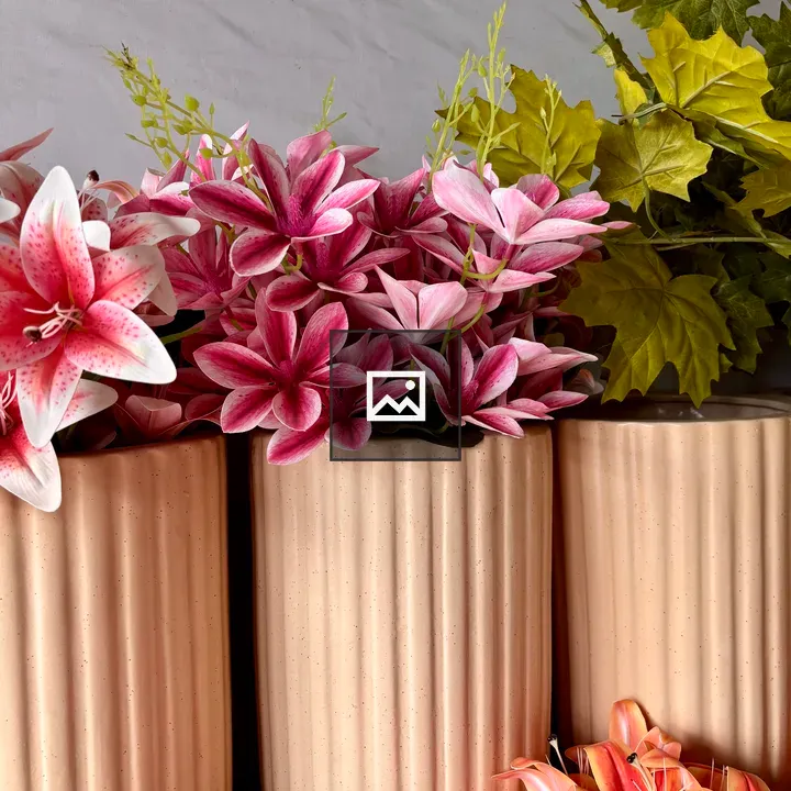Three decorative vases with flowers