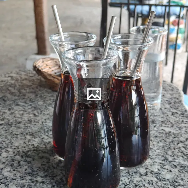 Three Glass Bottles with Straws