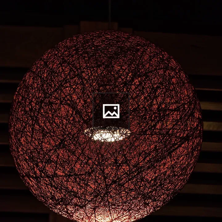Handmade round lamp with red threads