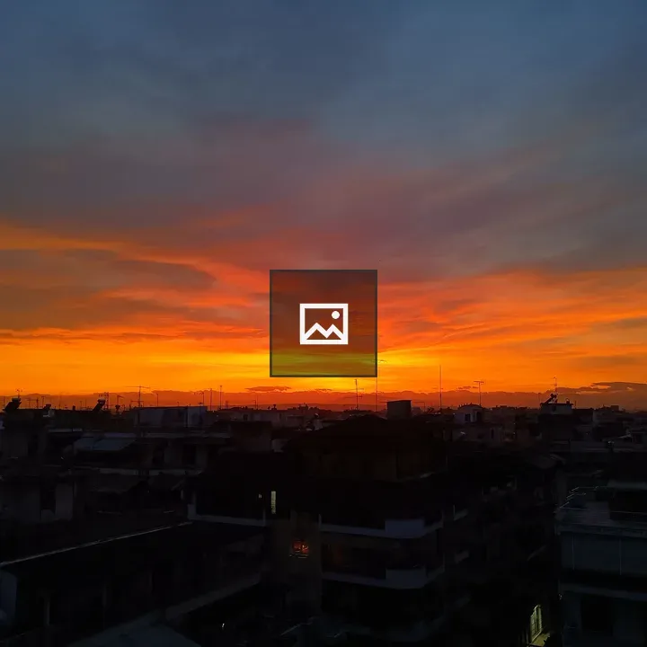 Sunset over a rooftop in Larissa
