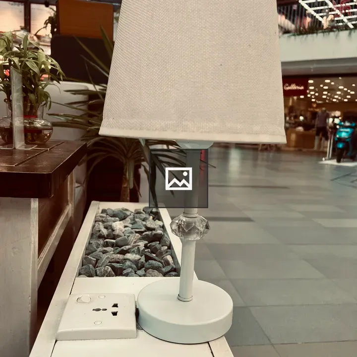 White lampshade on rocks table