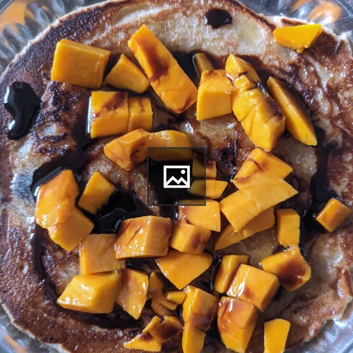 Pancake with Mangoes and Syrup
