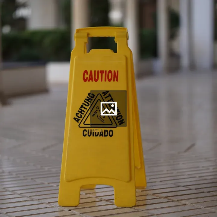 Caution Sign on Tiled Floor