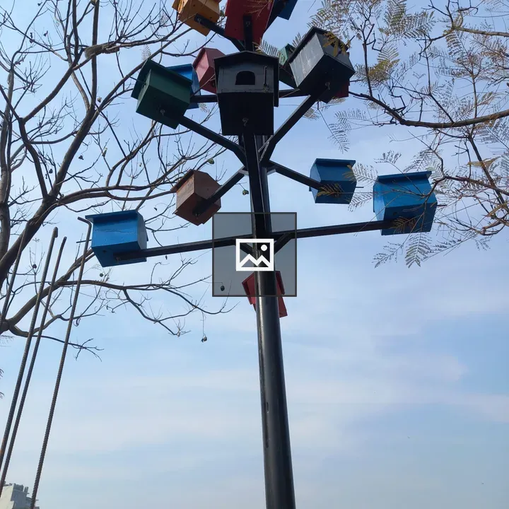 Tall pole with colorful birdhouses