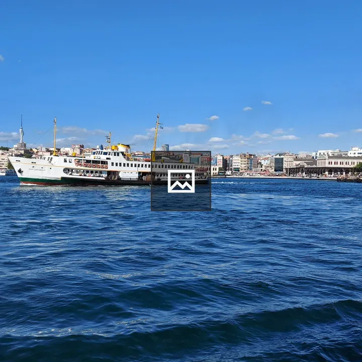 White ferry with yellow masts