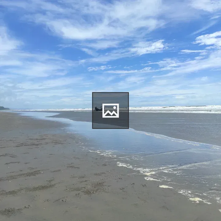 Beach scene with boat on horizon