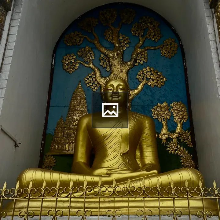 Golden Buddha Statue with Tree Backdrop