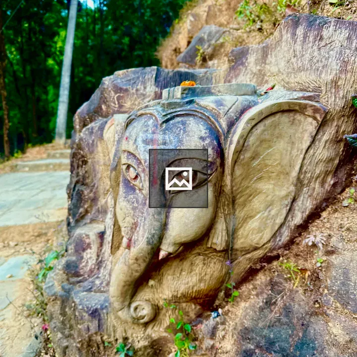 Ganesha sculpture embedded in rock