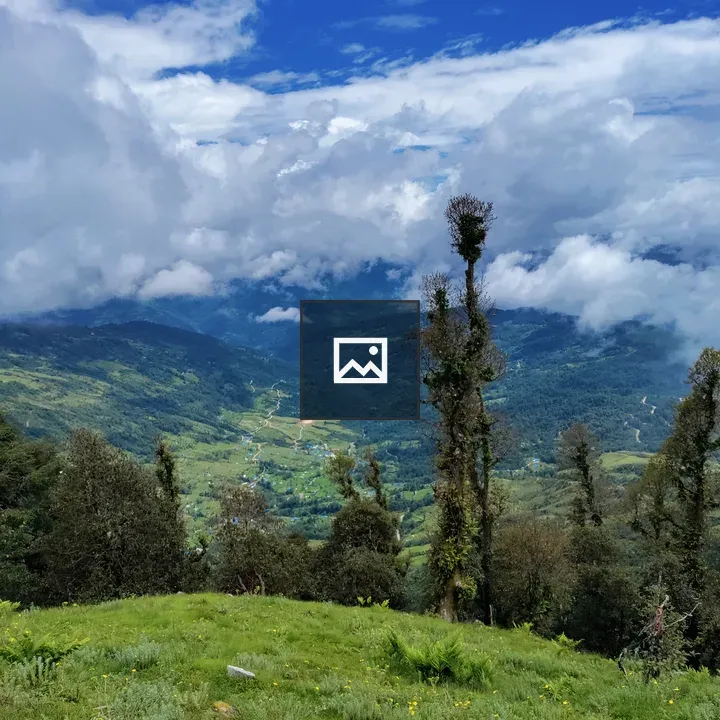 Green hills under blue sky