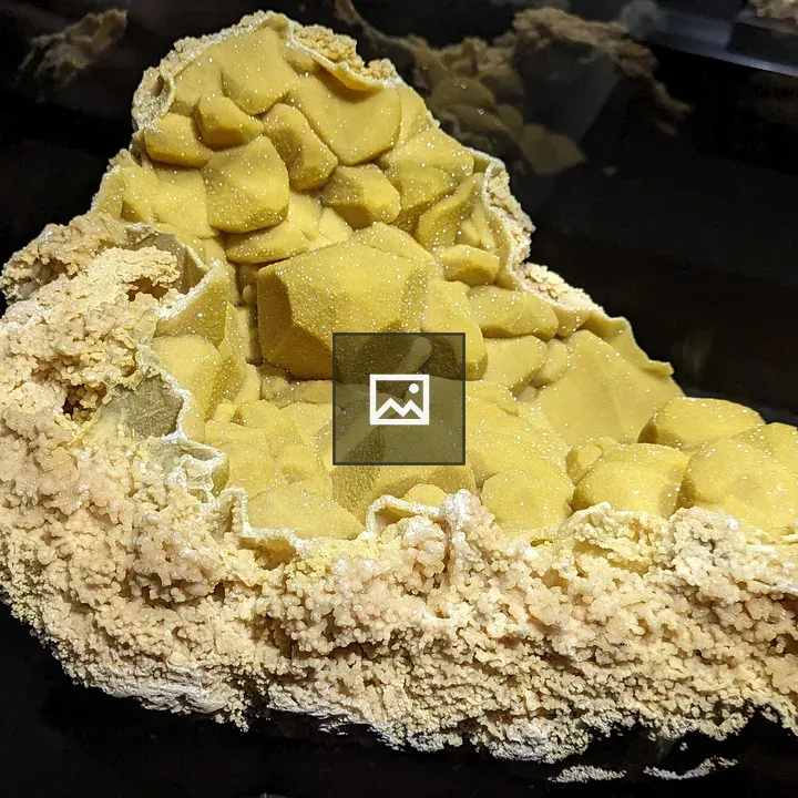 Bunch of sparkling yellow mineral shapes