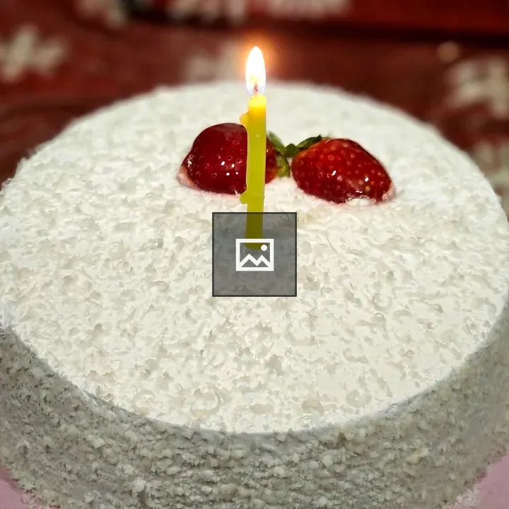 Round coconut cake with strawberries