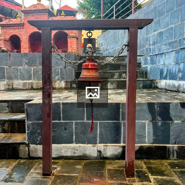 Temple bell at stone staircase