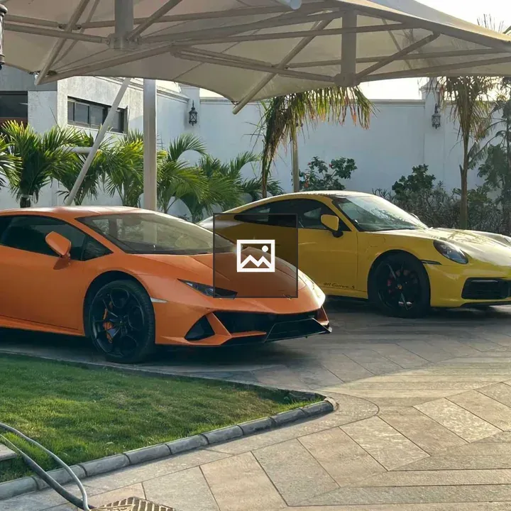 Yellow Porsche 911 and Orange Huracan EVO