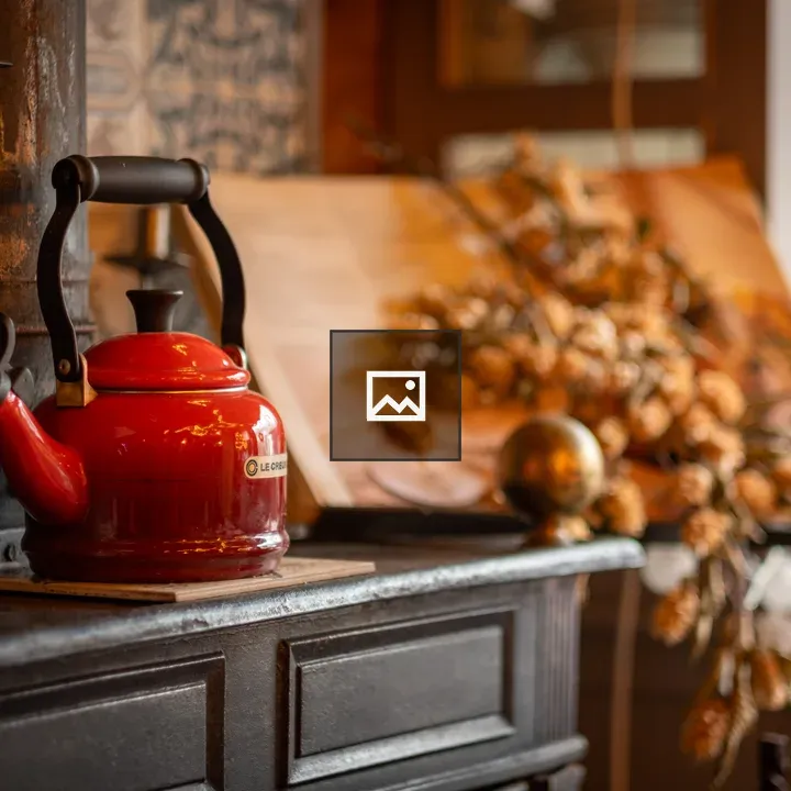 Red kettle on cupboard