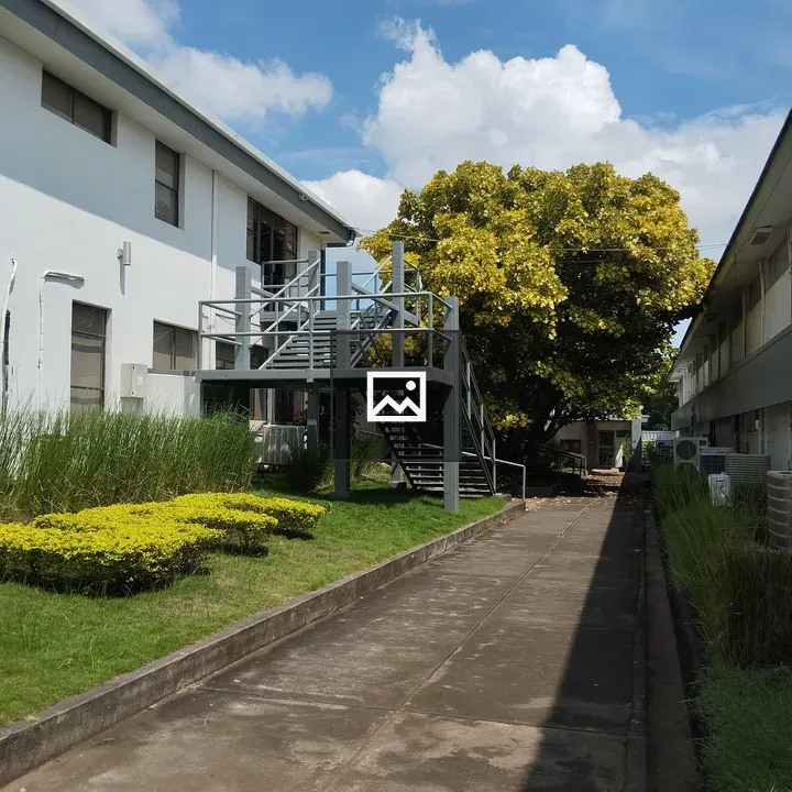 Concrete road between buildings