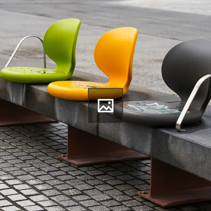 Three colored curved chairs