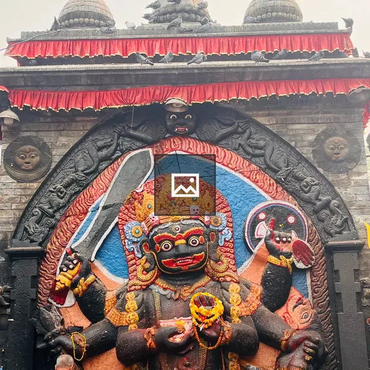 Stone sculpture of multi-armed deity