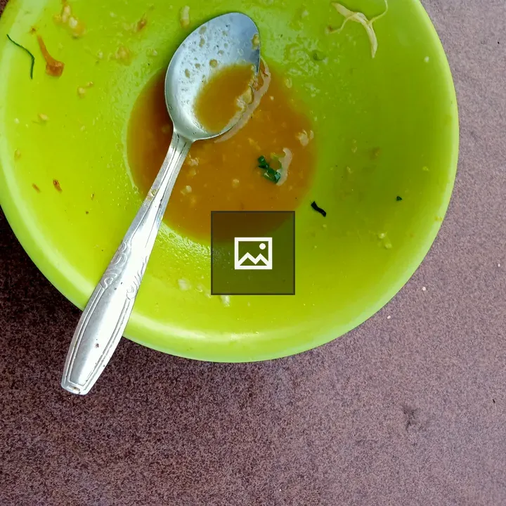Food in Green Bowl with Spoon