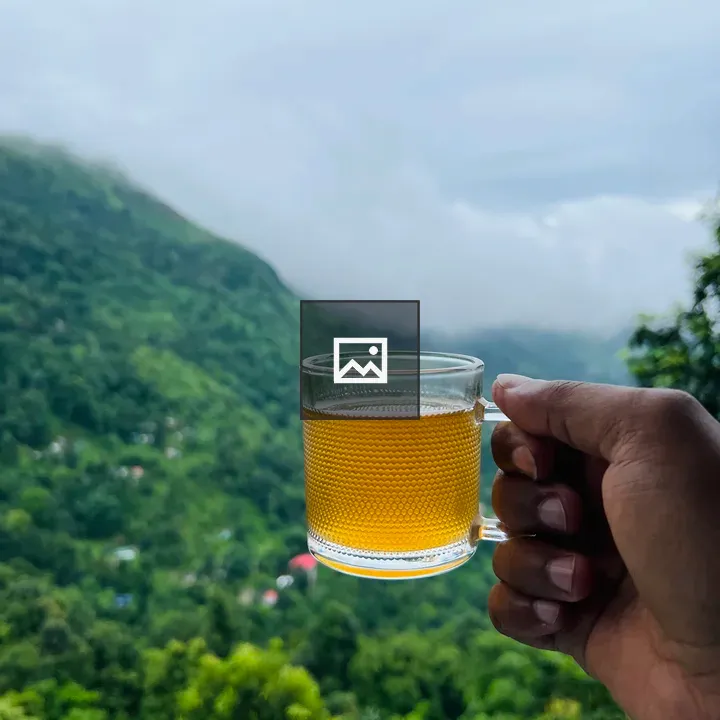 Hand holding tea mug