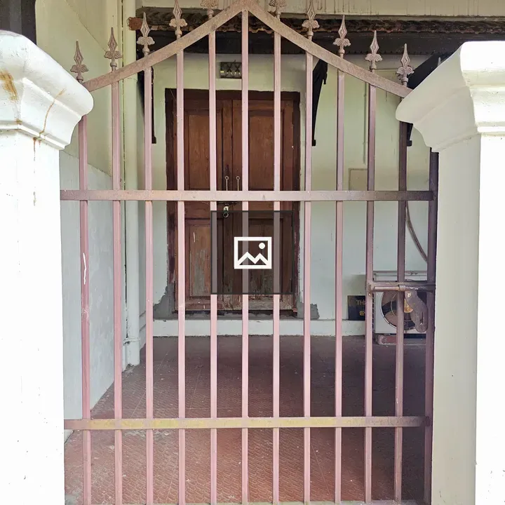 Old iron gate and wooden door