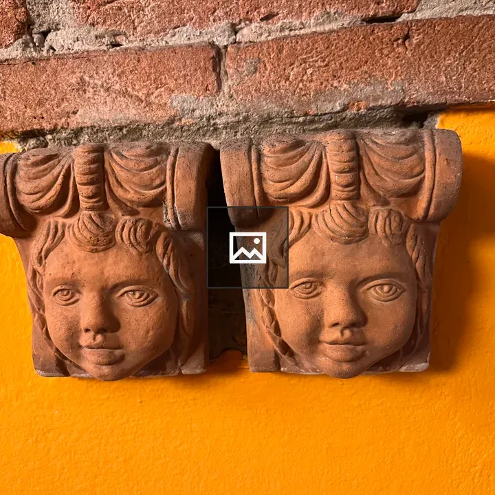 Decorative clay cherubs