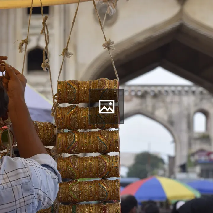 Man Hanging Bangles in Marketplace